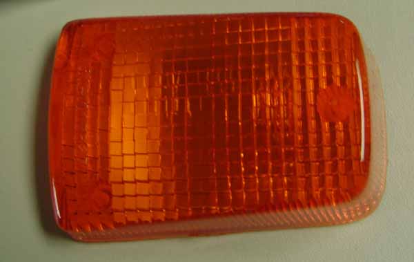 Emgo indicator lens. 7.1cm long, 4.2cm wide (ID). 3 mounting holes. 60-76038